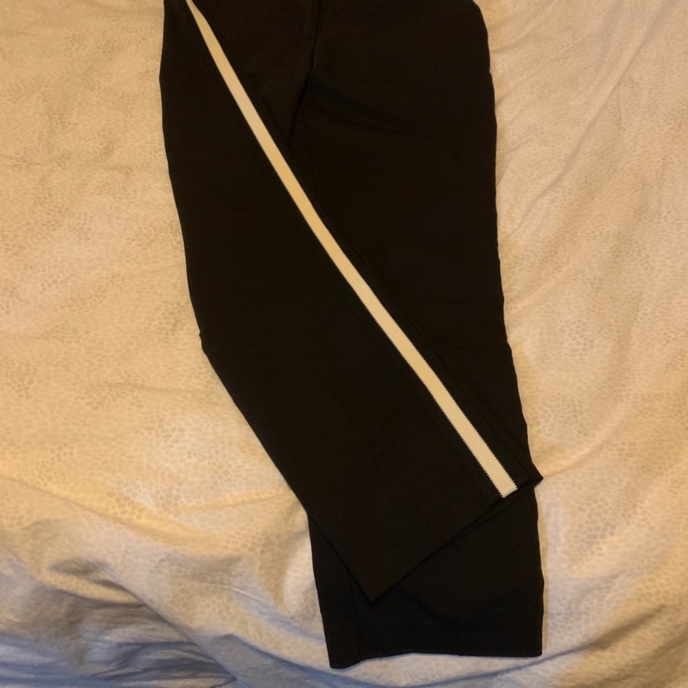 Black pants with white stripe down the side